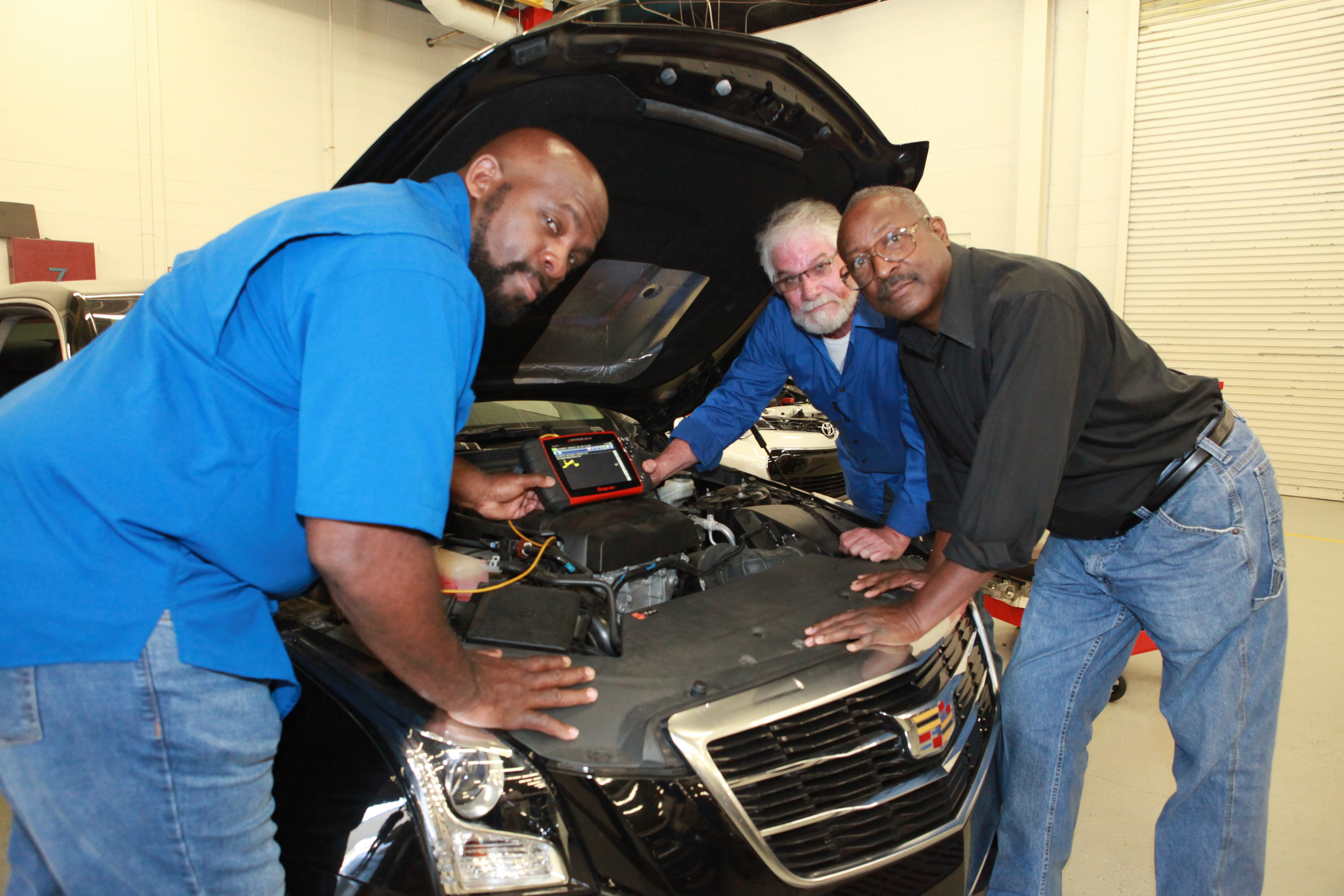 Automotive technology instructors (from left) Kenneth Harper of Tupelo